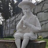 Statue enfant musicien